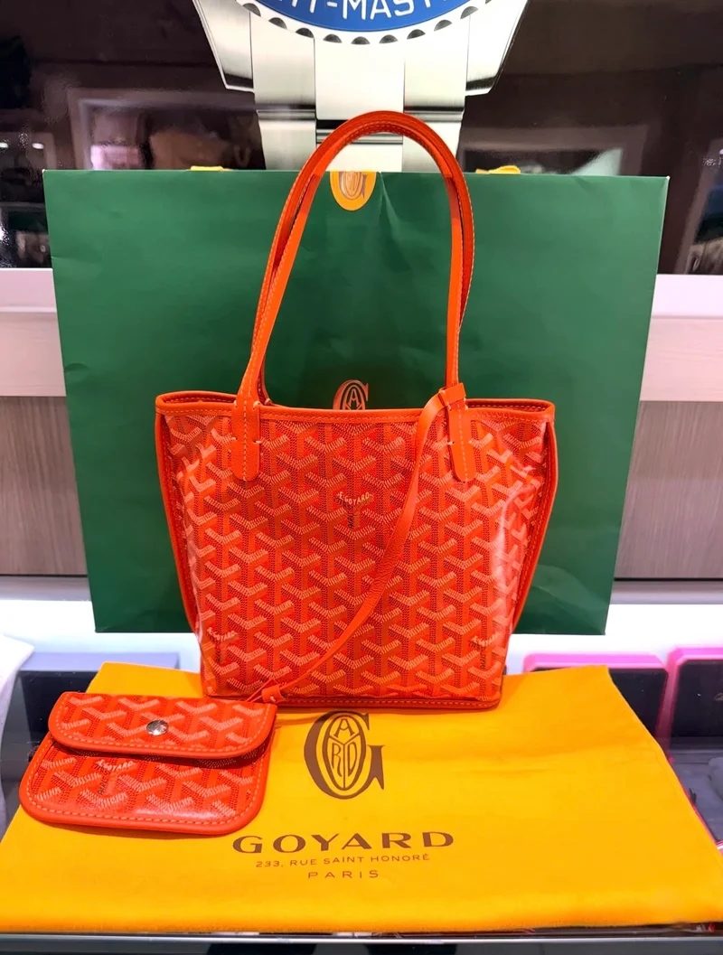 Borsa tote mini Anjou reversibile in tela rivestita arancione e pochette abbinata, come nuove (2024)