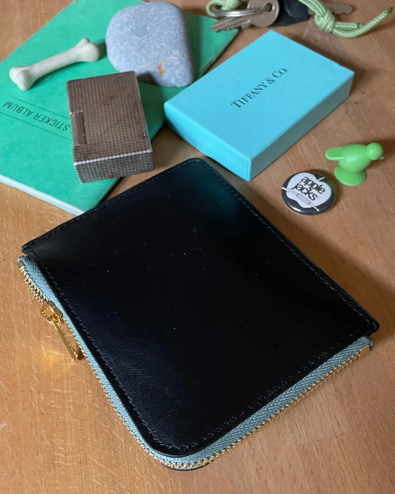 IL BAU pelle nero + zip verde acqua