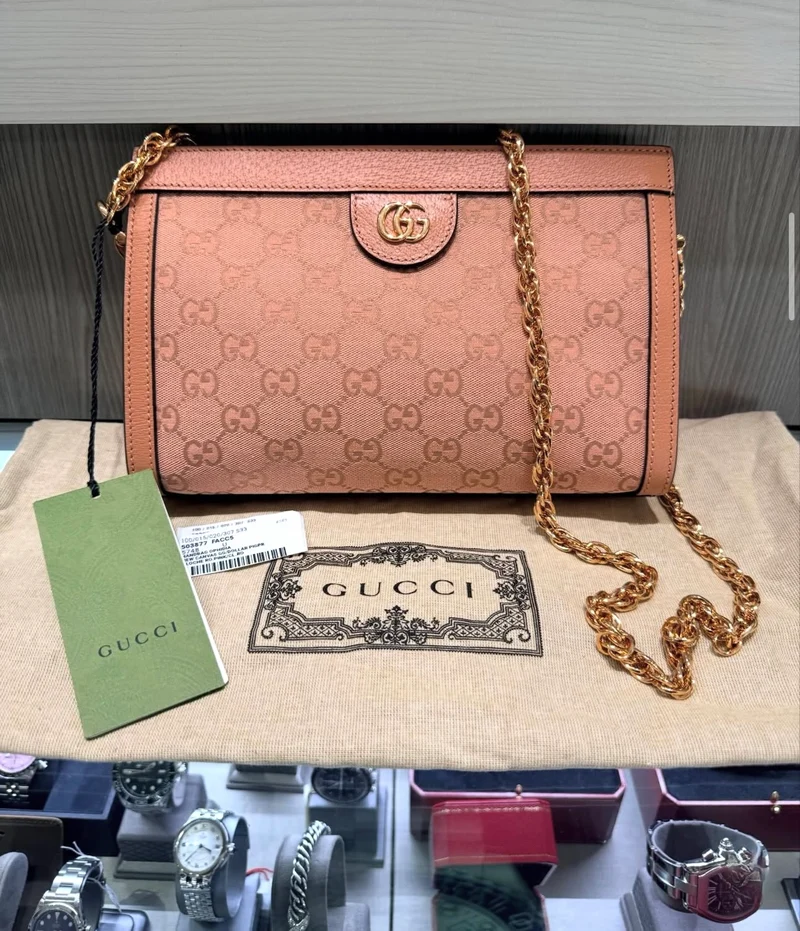 Borsa a tracolla strutturata Gucci Ophidia in tela GG rosa (modello n. 503877) usata.
