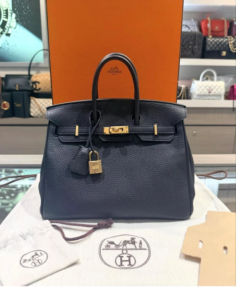 Borsa Hermes Birkin 25 usata, in pelle Togo nera con finiture dorate e timbro T.